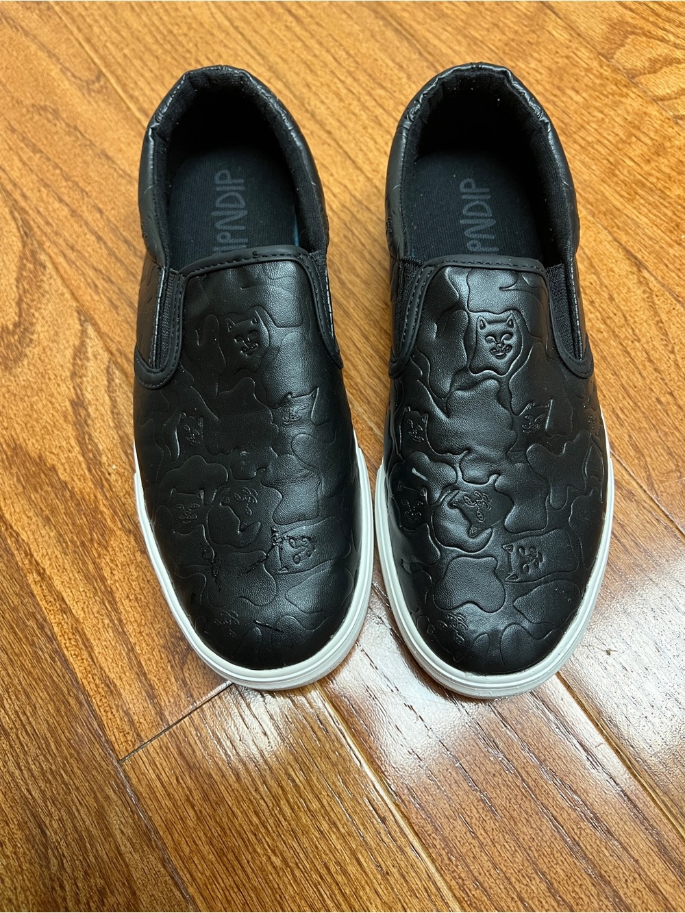Black Slip-On ripndip Shoes with Embossed Cat Pattern
